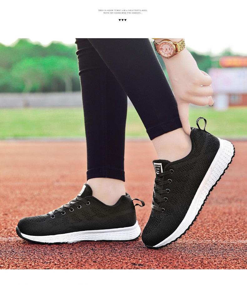 Stevvex Women casual breathable mesh lace-up sneakers black upper with white sole pair on Tampa Home & Garden Store