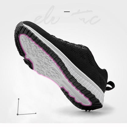 Women Stevvex breathable mesh lace-up sneakers, black upper, white sole with pink trim on Tampa Home & Garden Store