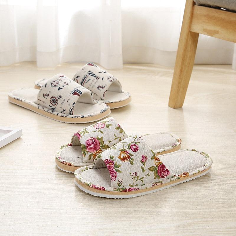 Women floral cloth indoor slippers with open toe and two wide straps; 2 pairs shown on Tampa Home & Garden Store