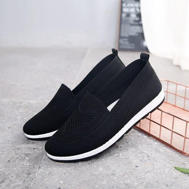Pair of women’s black breathable mesh slip-on espadrilles with white sole on Tampa Home & Garden Store