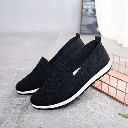 Pair of women’s black breathable mesh slip-on espadrilles with white sole on Tampa Home & Garden Store