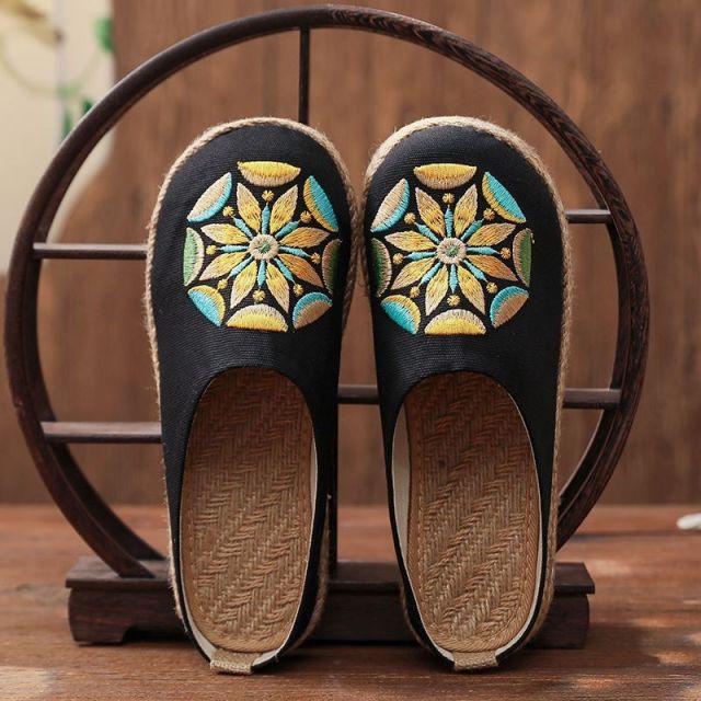 Pair of black linen handmade mules with colorful embroidered star motif, espadrille sole on Tampa Home & Garden Store