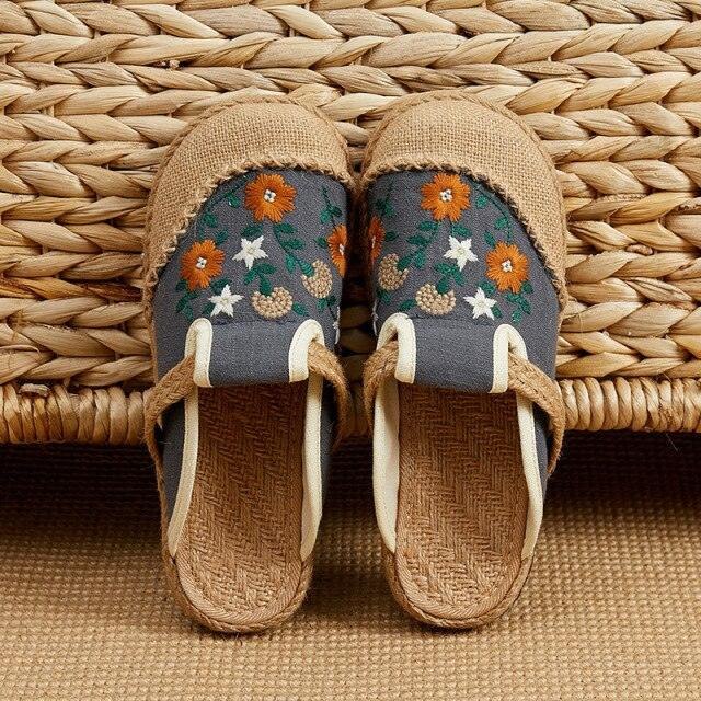 Women linen handmade mules with floral embroidery on blue-gray canvas and jute sole on Tampa Home & Garden Store