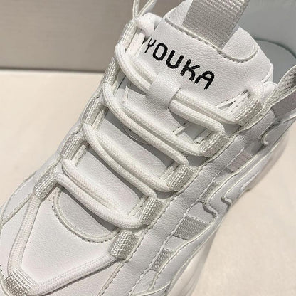 Women's white chunky platform sneakers with lace-up design and YOUKA logo on tongue on Tampa Home & Garden Store
