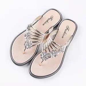 Stevvex women's silver crystal T-strap flat sandals, rhinestones, pair shown on footbeds on Tampa Home & Garden Store