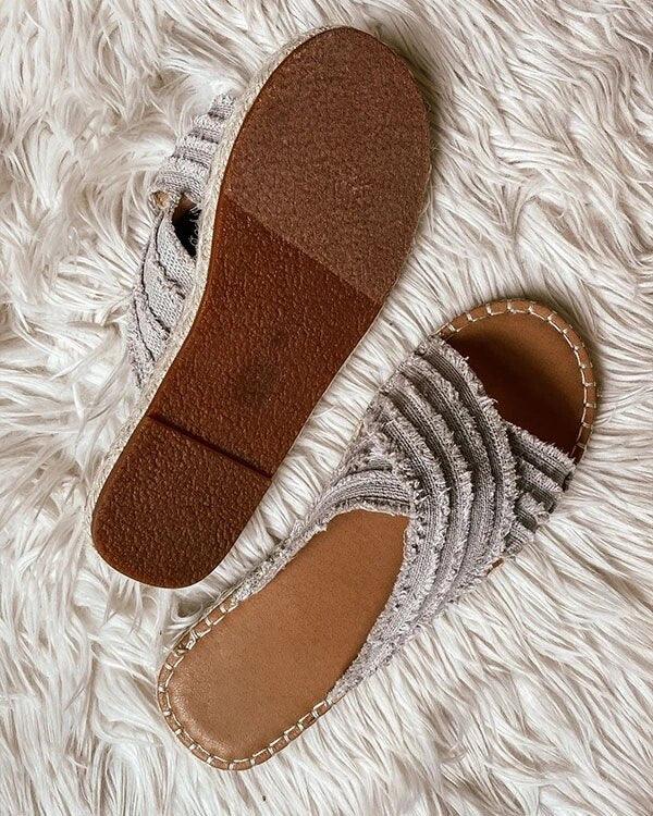 Pair of Stevvex open-toe flat sandals with cross-knit gray fabric straps on Tampa Home & Garden Store