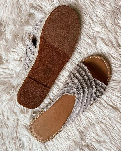 Pair of Stevvex open-toe flat sandals with cross-knit gray fabric straps on Tampa Home & Garden Store