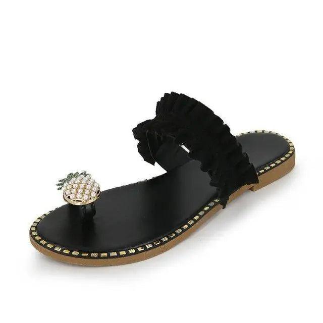 Stevvex women's flat sandal with black ruffled strap, pineapple charm, studded edge, tan sole on Tampa Home & Garden Store
