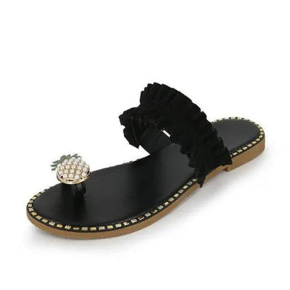 Stevvex women's flat sandal with black ruffled strap, pineapple charm, studded edge, tan sole on Tampa Home & Garden Store
