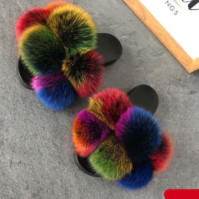Women Fluffy Faux Fur Slides by Stevvex with rainbow pom-poms and black soles, pair on Tampa Home & Garden Store