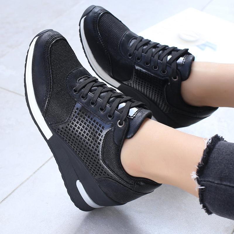 Women's height-increasing sneakers by Stevvex with black mesh panels and white sole on Tampa Home & Garden Store