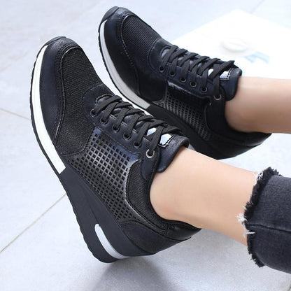 Women's height-increasing sneakers by Stevvex with black mesh panels and white sole on Tampa Home & Garden Store