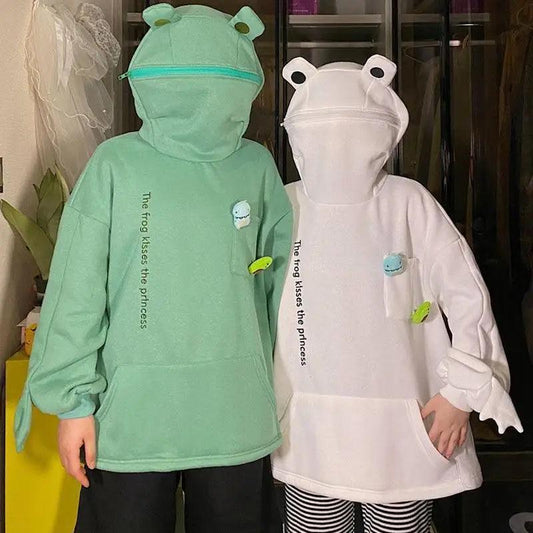 Two Stevvex frog hoodies: mint green and white, oversized pullover with frog-eye hood and pocket on Tampa Home & Garden Store