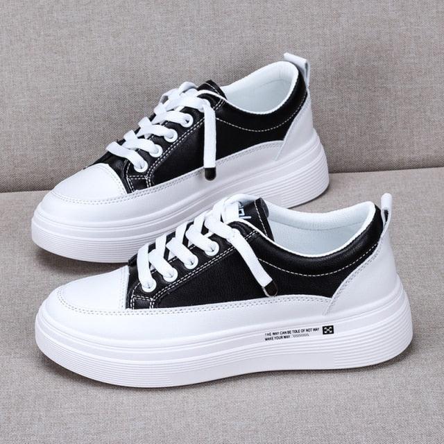 Stevvex women's leather sneakers pair with white platform sole, black upper and white laces on Tampa Home & Garden Store