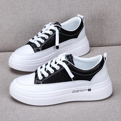 Stevvex women's leather sneakers pair with white platform sole, black upper and white laces on Tampa Home & Garden Store