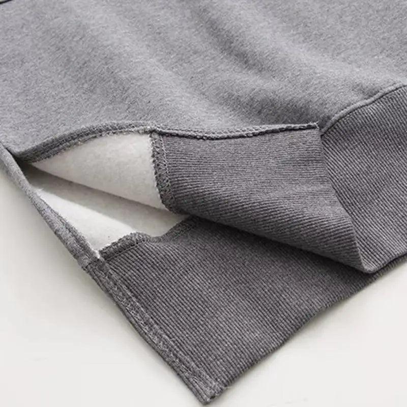Women loose long gray hoodie with ribbed cuffs and white fleece lining on Tampa Home & Garden Store