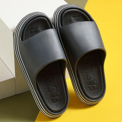 Stevvex women’s black EVA slides with thick white-striped sole open-toe casual slippers pair on Tampa Home & Garden Store