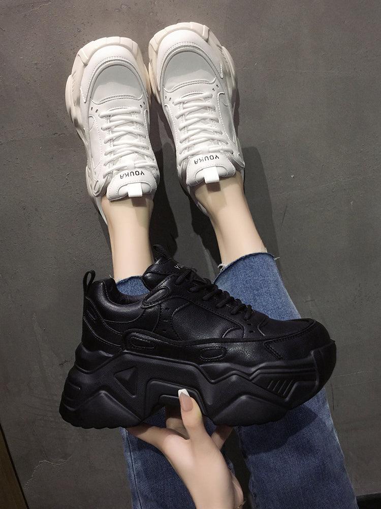 Women platform leather sneakers: white pair on feet and black pair held in hand, Stevvex ST85SH3303DSF on Tampa Home & Garden Store