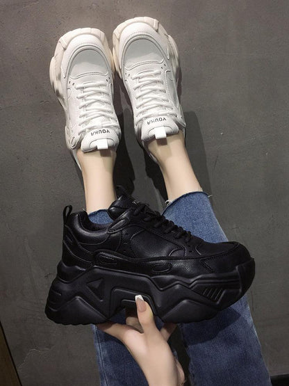 Women platform leather sneakers: white pair on feet and black pair held in hand, Stevvex ST85SH3303DSF on Tampa Home & Garden Store
