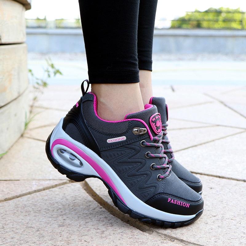 Women running air cushion athletic sneakers with black gray mesh upper and pink accents on Tampa Home & Garden Store