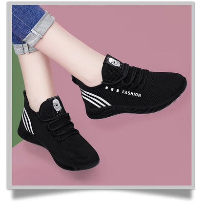Womens black running shoes with breathable mesh, white side stripes, Stevvex brand pair on Tampa Home & Garden Store
