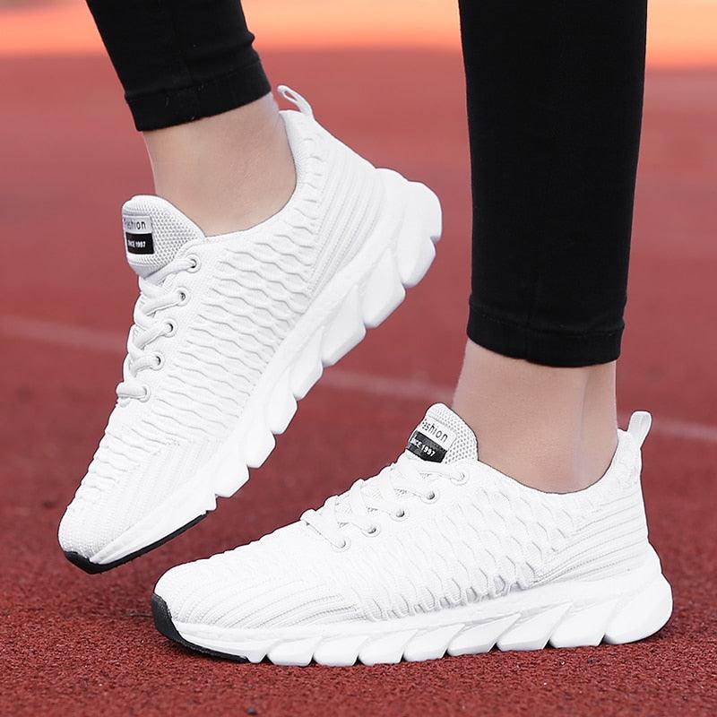 White Stevvex women's running sneakers with breathable mesh, lightweight lace-up pair on Tampa Home & Garden Store