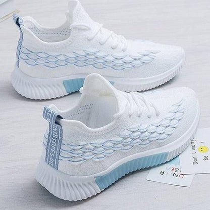 Stevvex white knit running sneakers pair, blue outsole accents, non-slip casual gym shoes on Tampa Home & Garden Store