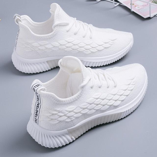 Stevvex white running sneakers pair with breathable knit upper and ribbed outsole on Tampa Home & Garden Store