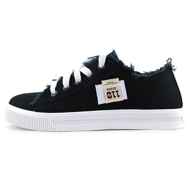 Stevvex women's black canvas sneakers with white sole and lace-up, side patch badge on Tampa Home & Garden Store