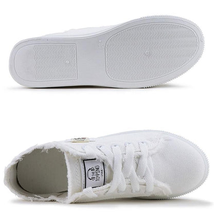 White canvas sneakers, low-top lace-up, Stevvex casual shoes with textured outsole on Tampa Home & Garden Store