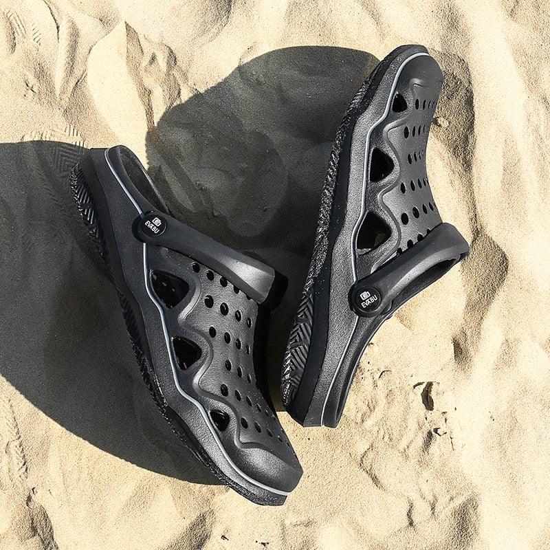 Stevvex women's slip-on garden clogs pair with black-gray perforated upper on sand on Tampa Home & Garden Store