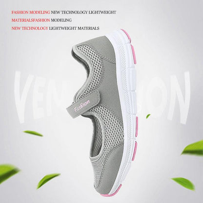 Women's grey mesh sneakers with pink trim and velcro strap, lightweight walking shoes on Tampa Home & Garden Store