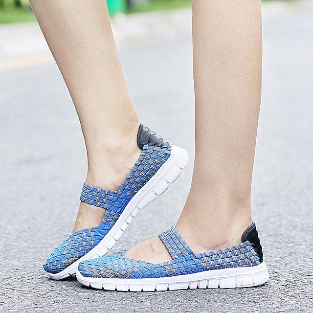 Women’s blue woven espadrille sneakers with white sole and back heel tab on Tampa Home & Garden Store