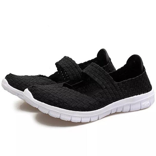 Women's Stevvex black woven espadrille sneakers pair, slip-on casual flats with white outsole on Tampa Home & Garden Store
