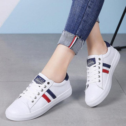 Stevvex women's white leather sneakers with navy red side stripes, casual vulcanized sole pair on Tampa Home & Garden Store