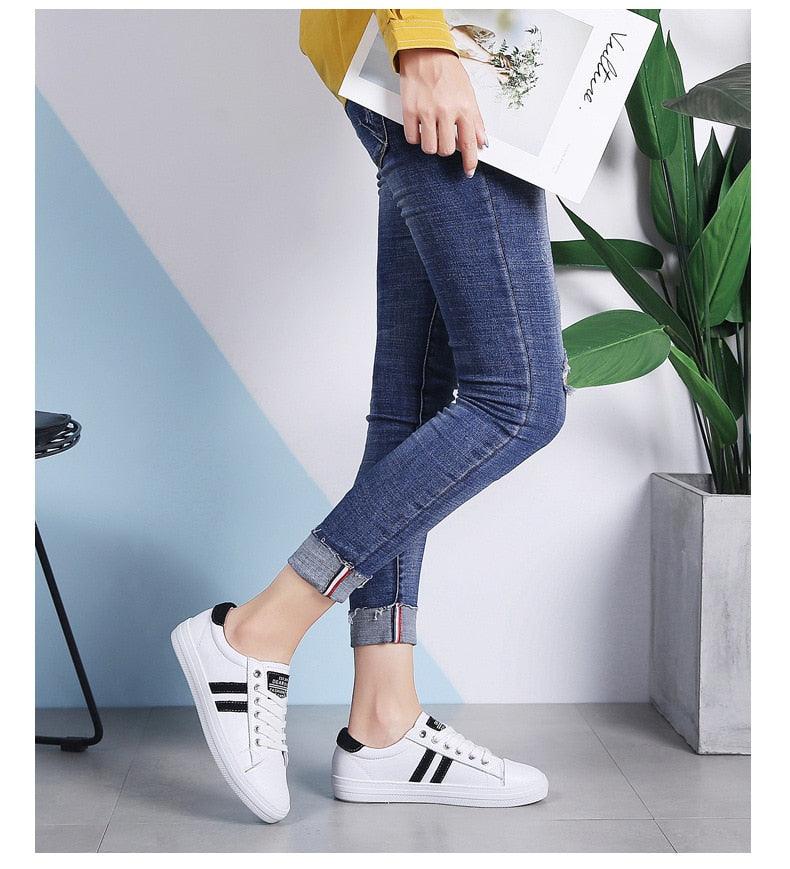 Women's white leather sneakers with black stripes, casual flat tennis shoes Stevvex on Tampa Home & Garden Store