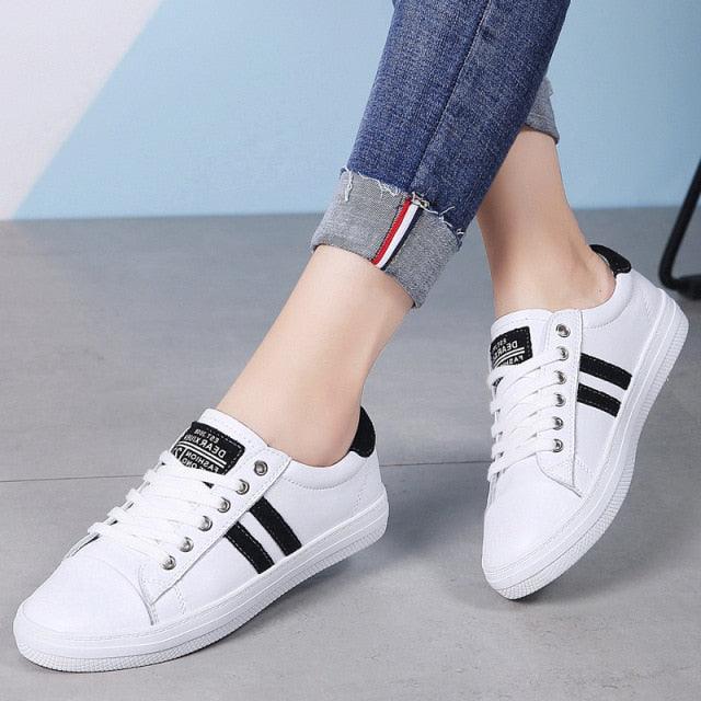 Stevvex women's white leather sneakers with black side stripes, lace-up casual sport shoes pair on Tampa Home & Garden Store