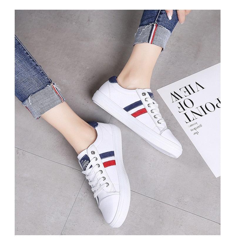 Stevvex white leather sneakers with red and navy side stripes, lace-up fashion shoes pair on Tampa Home & Garden Store