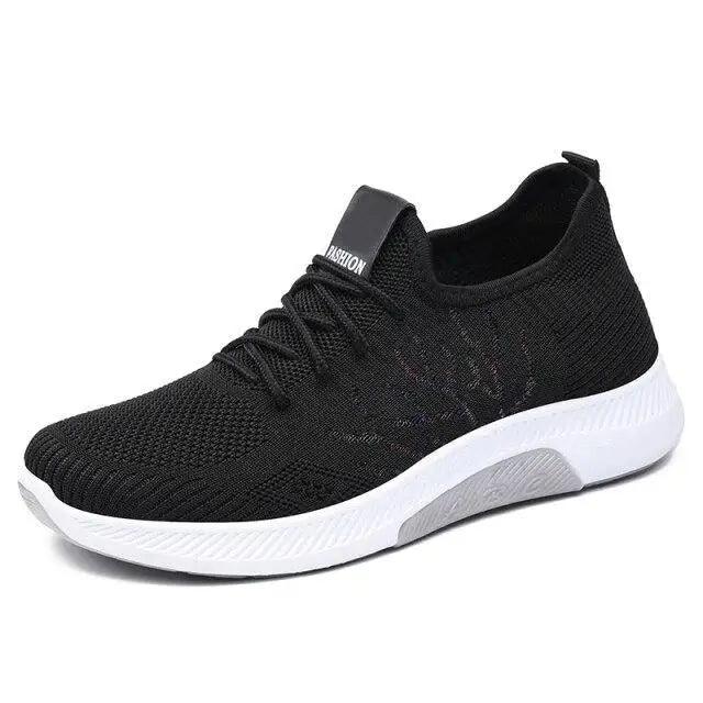 Women's mesh breathable lace-up sneakers with black knit upper and white sole on Tampa Home & Garden Store