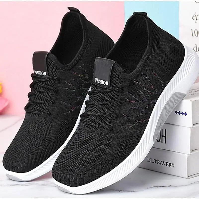 Stevvex women's mesh breathable sneakers, black knit upper, white sole, pair on Tampa Home & Garden Store