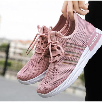 Pair of pink Stevvex women's mesh breathable sneakers with knit upper and white sole on Tampa Home & Garden Store