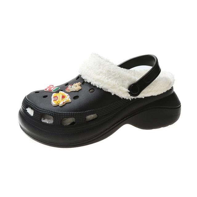 Stevvex black slip-on clog slippers with white fur lining and patches on top on Tampa Home & Garden Store