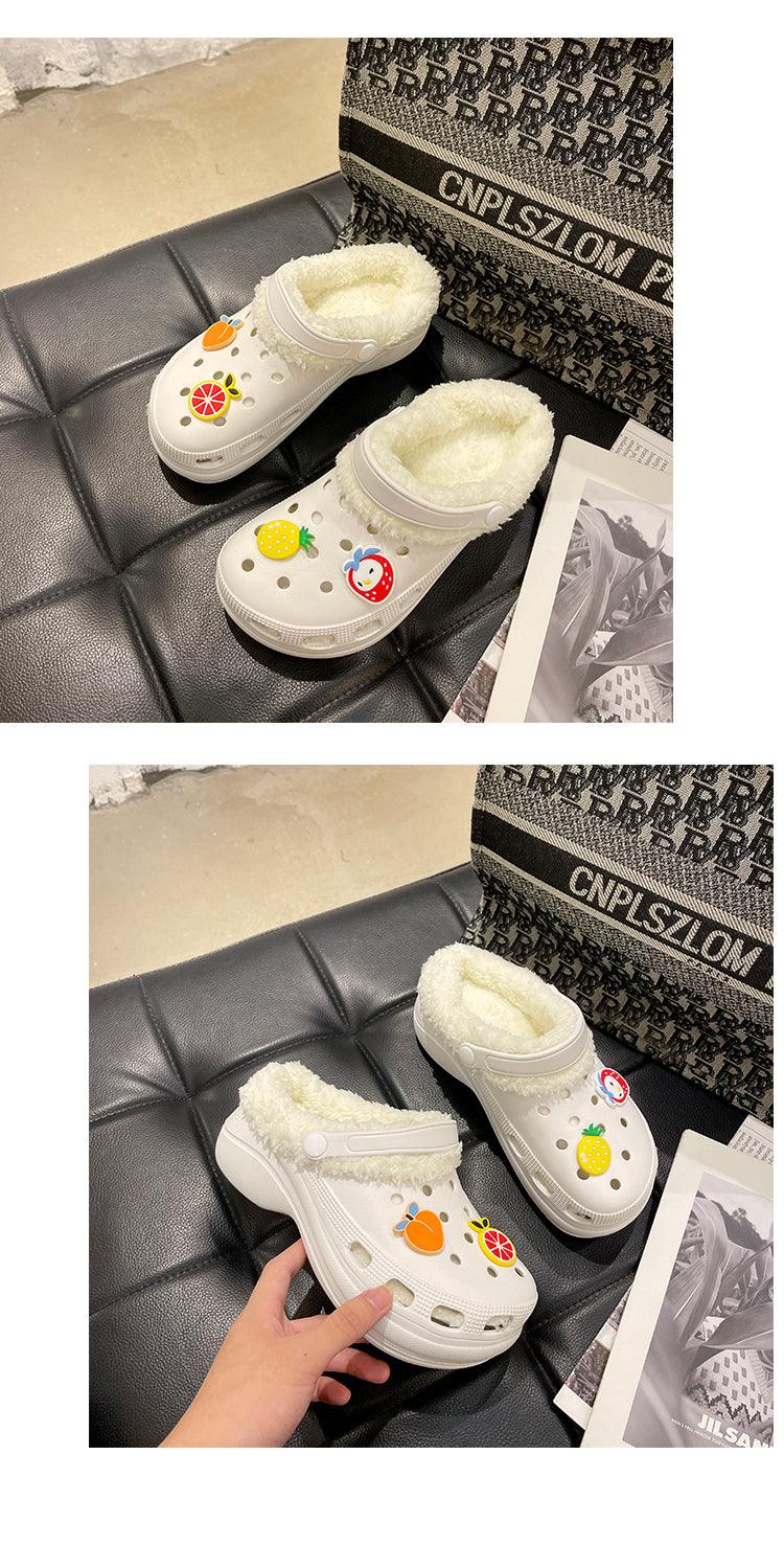 Two white women's slip-on clog slippers with plush lining and fruit patches on Tampa Home & Garden Store