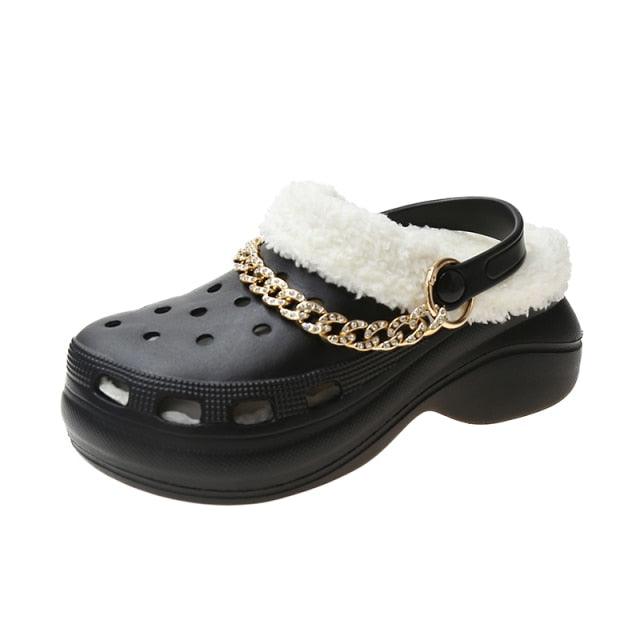 Women's Stevvex black leather clog slipper with white faux fur trim and gold chain strap on Tampa Home & Garden Store