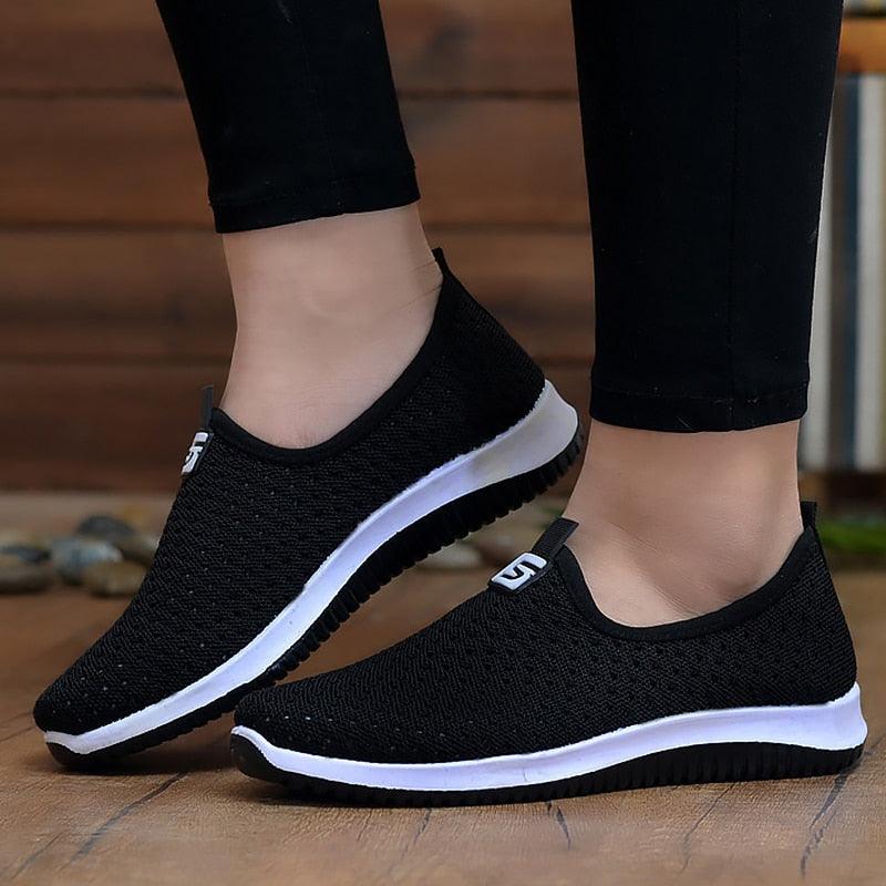 Stevvex black breathable mesh slip-on sneakers pair with white sole for casual walking on Tampa Home & Garden Store