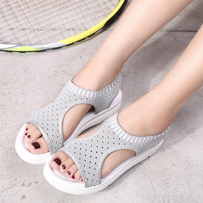 Pair of grey knit platform sandals with open toe and elastic ankle strap, white sole on Tampa Home & Garden Store