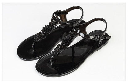Stevvex women's black sandals with floral T-strap, flat non-slip dressy beach slides on Tampa Home & Garden Store