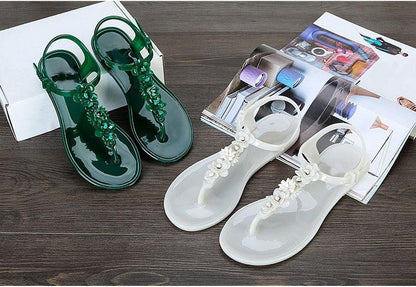 Stevvex Women Sandals two pairs green and white floral T-strap flip flops on wood floor on Tampa Home & Garden Store