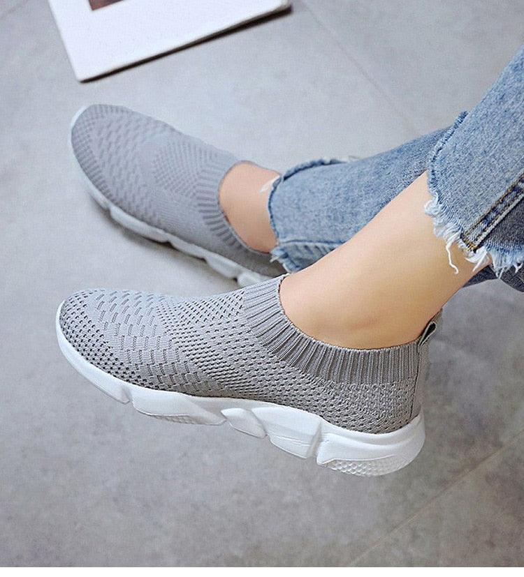 Women slip-on knit sneakers with light grey mesh upper and white chunky sole on Tampa Home & Garden Store