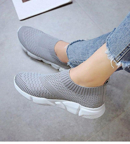 Women slip-on knit sneakers with light grey mesh upper and white chunky sole on Tampa Home & Garden Store